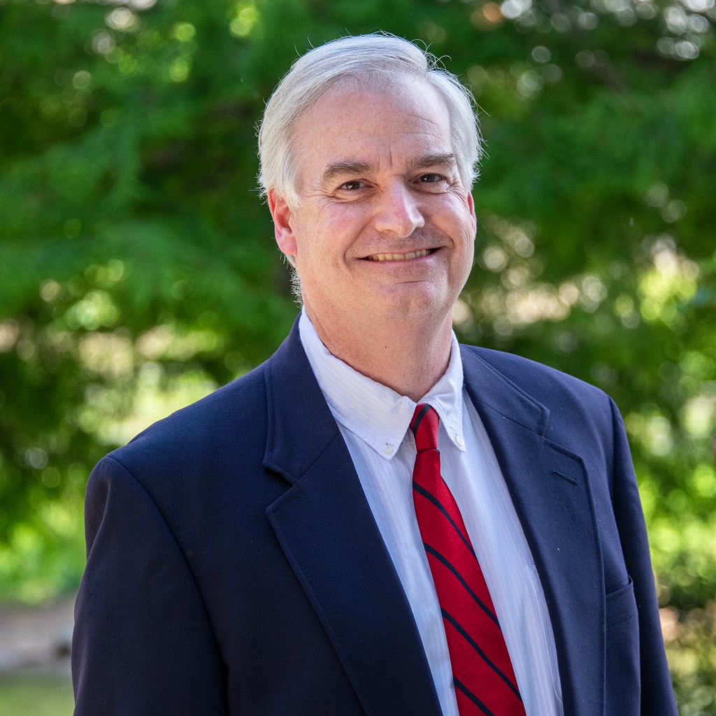 A computer monitor displaying various graphs and data visualizations on the screen